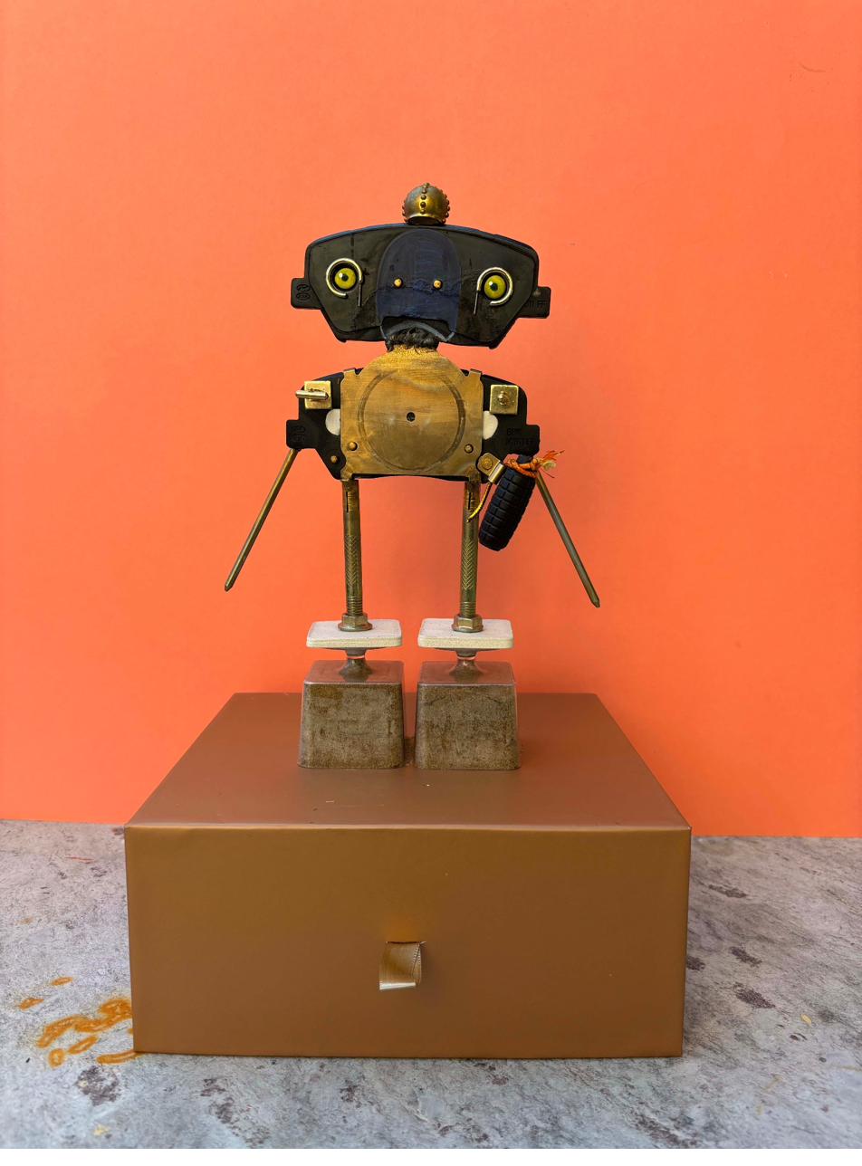 Robot assemblage sculpture from brake pads