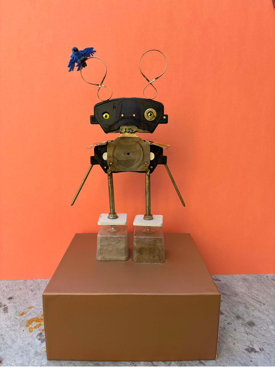 Robot assemblage with blue clay bird