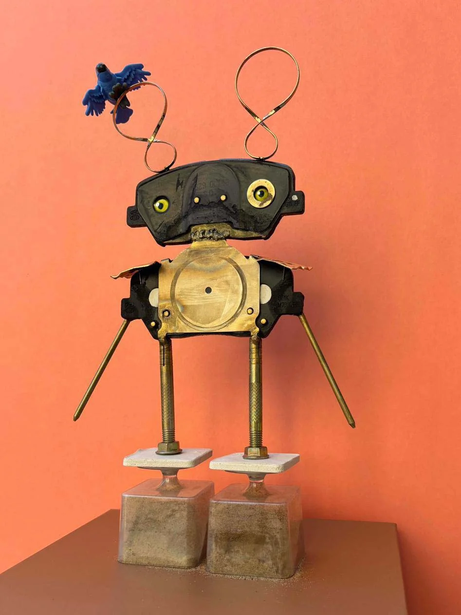 Bomb and Bird — assemblage sculpture with blue bird