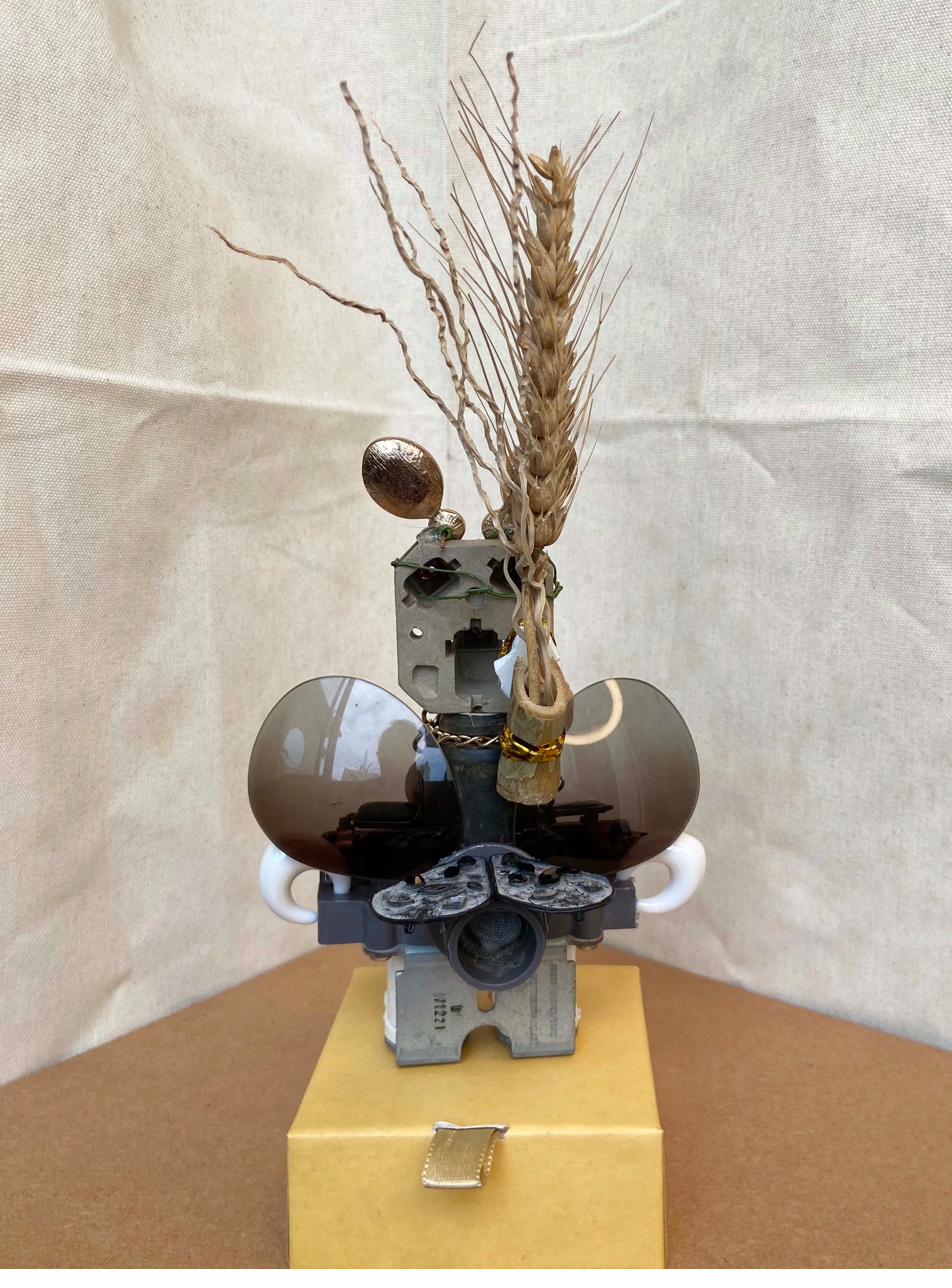 Assemblage figure with sunglass lenses