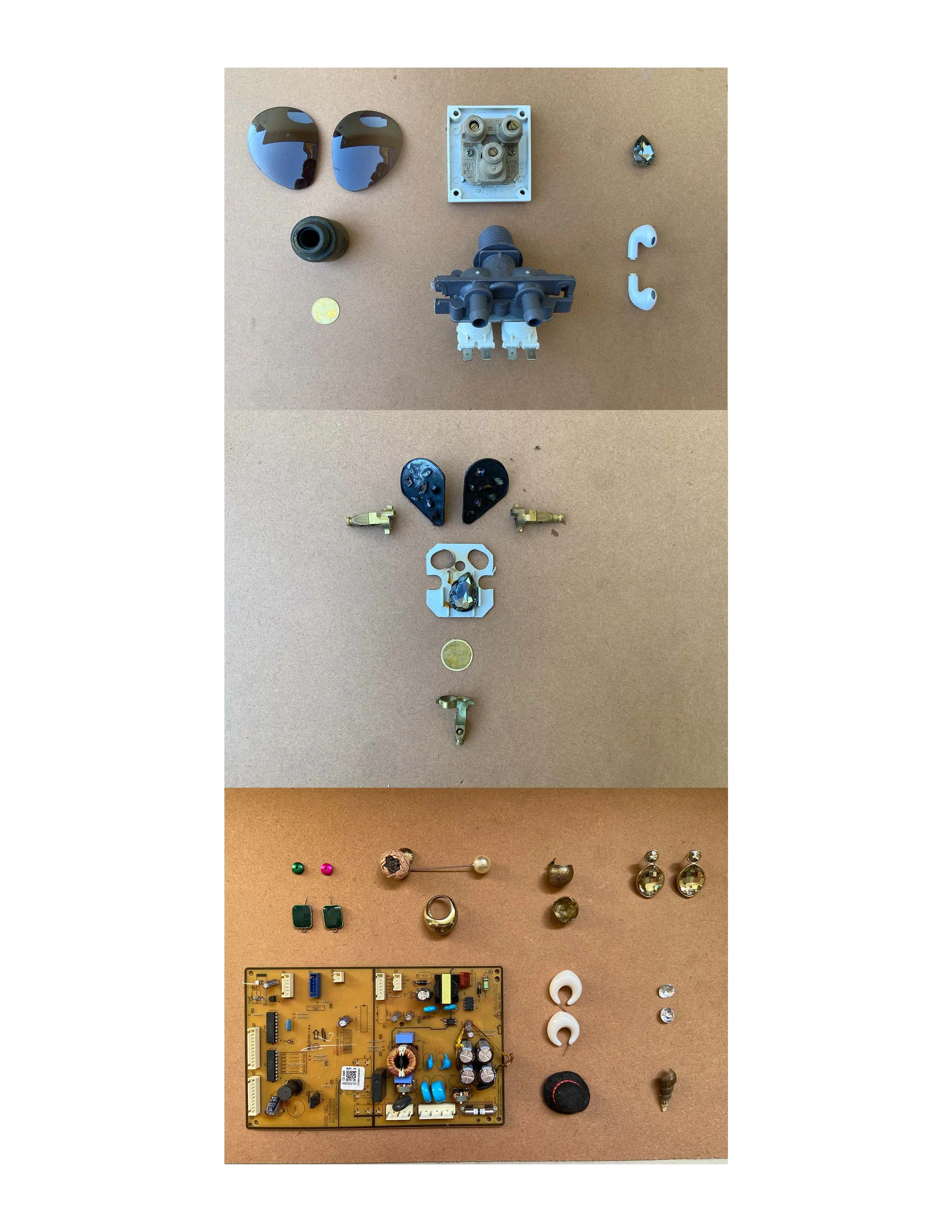 Material components of Project Lover Girl laid out: hardware, jewellery, circuit boards, wheat, and cultural artefacts.
