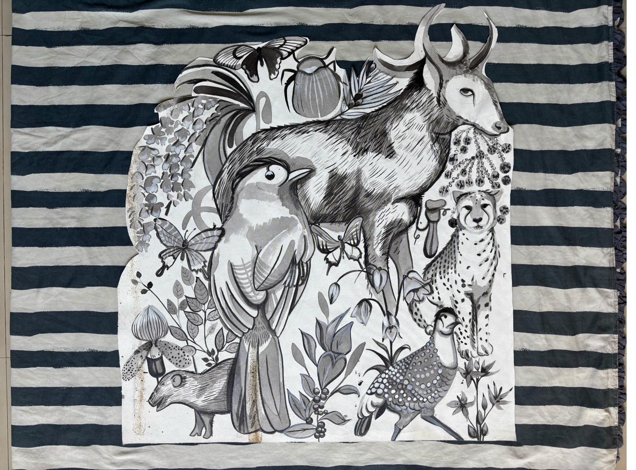 Monochrome mural on striped fabric featuring birds and wildlife