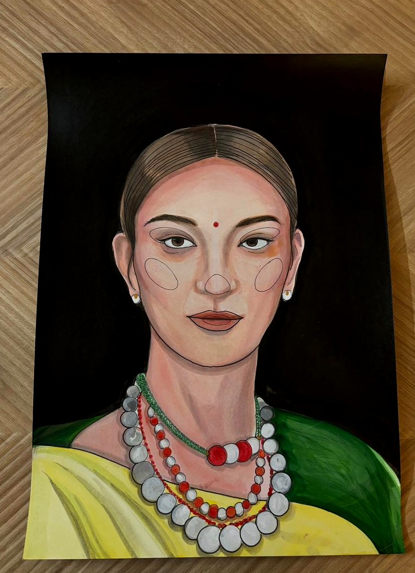 Portrait of woman with bindi in green and yellow sador