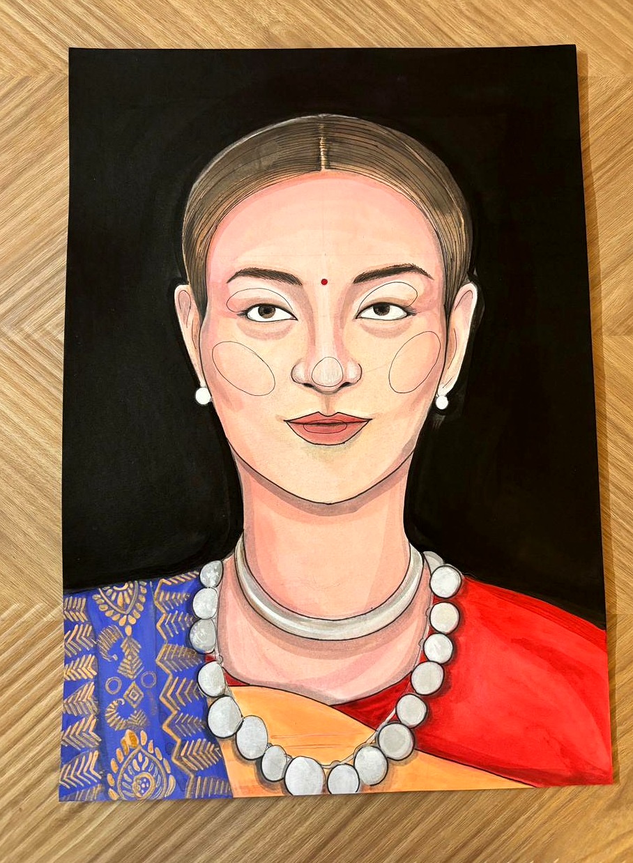 Portrait of woman in blue and red mekhela sador