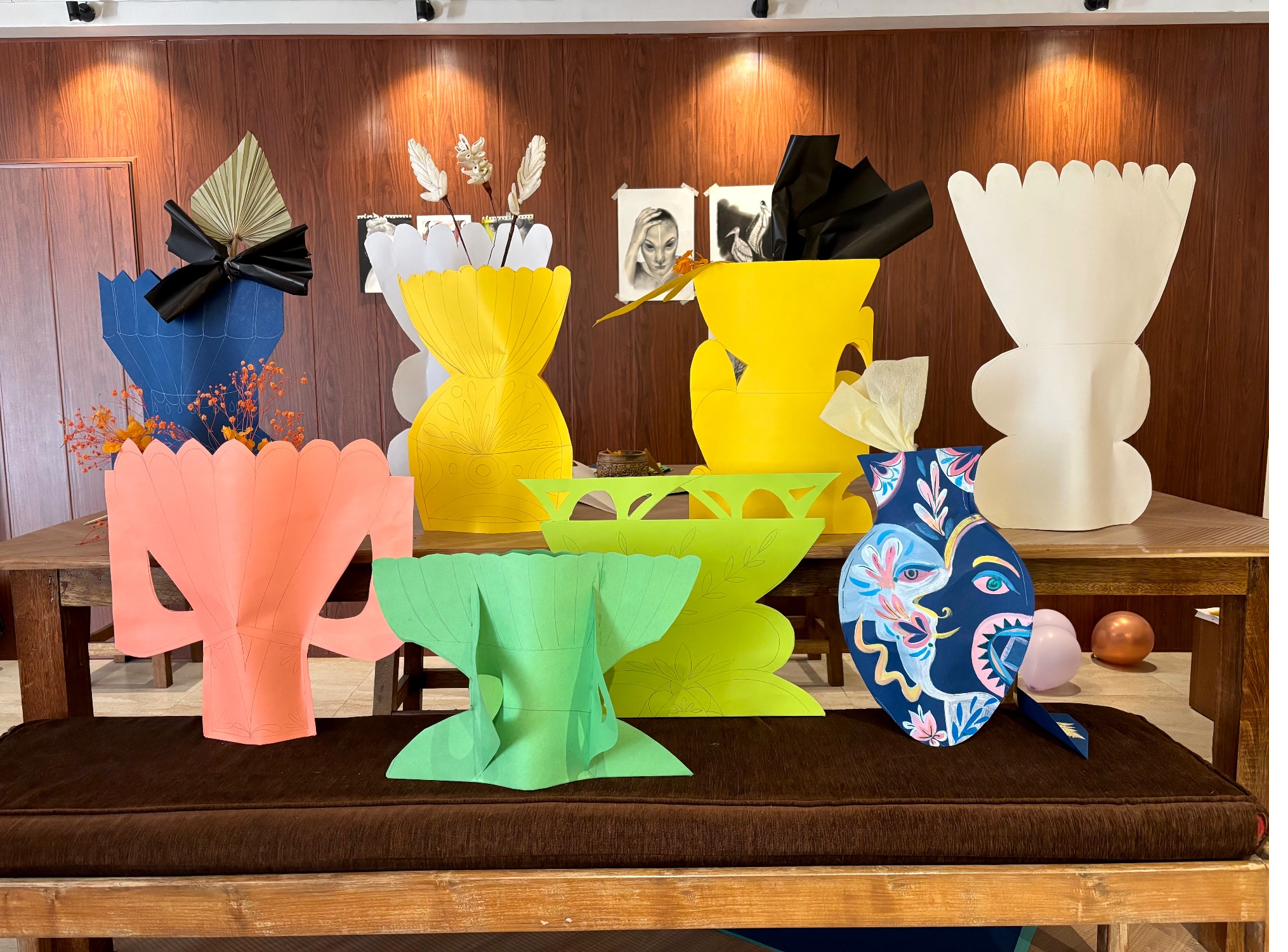 Collection of colourful paper sculpture vases at YOBO Studio